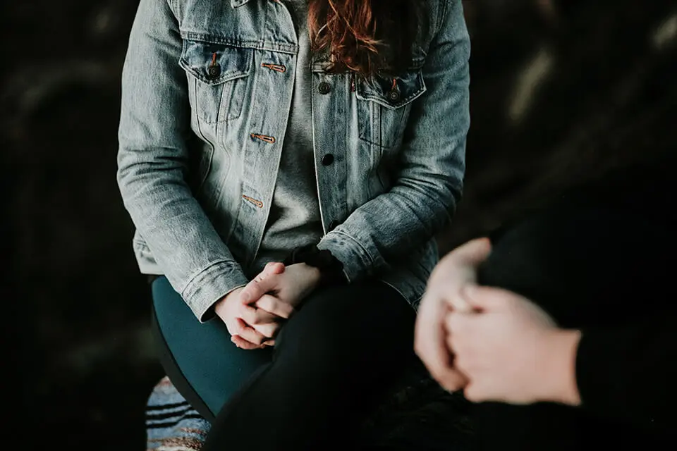Woman speaking with a therapist