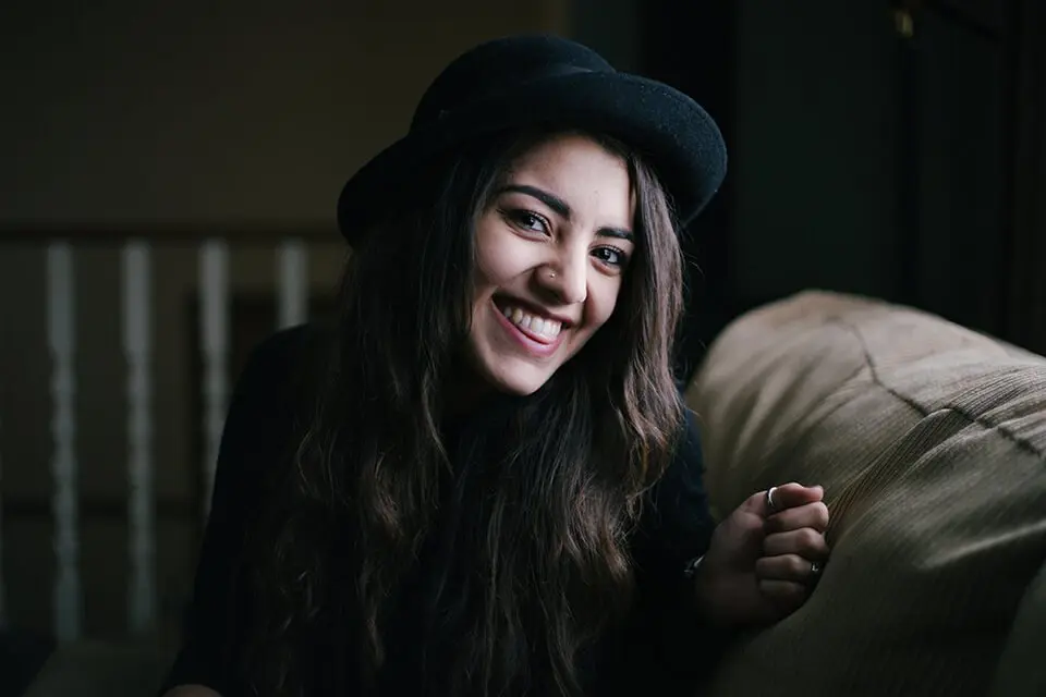 Woman happy looking into camera