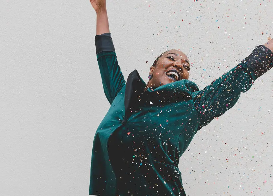 Woman celebrating with confetti