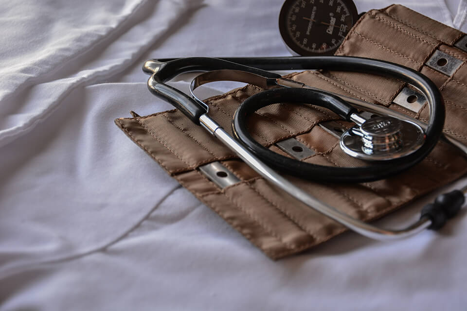 Doctor's equipment on a white sheet