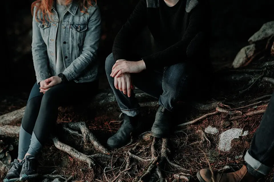 Couple sitting outside together talking