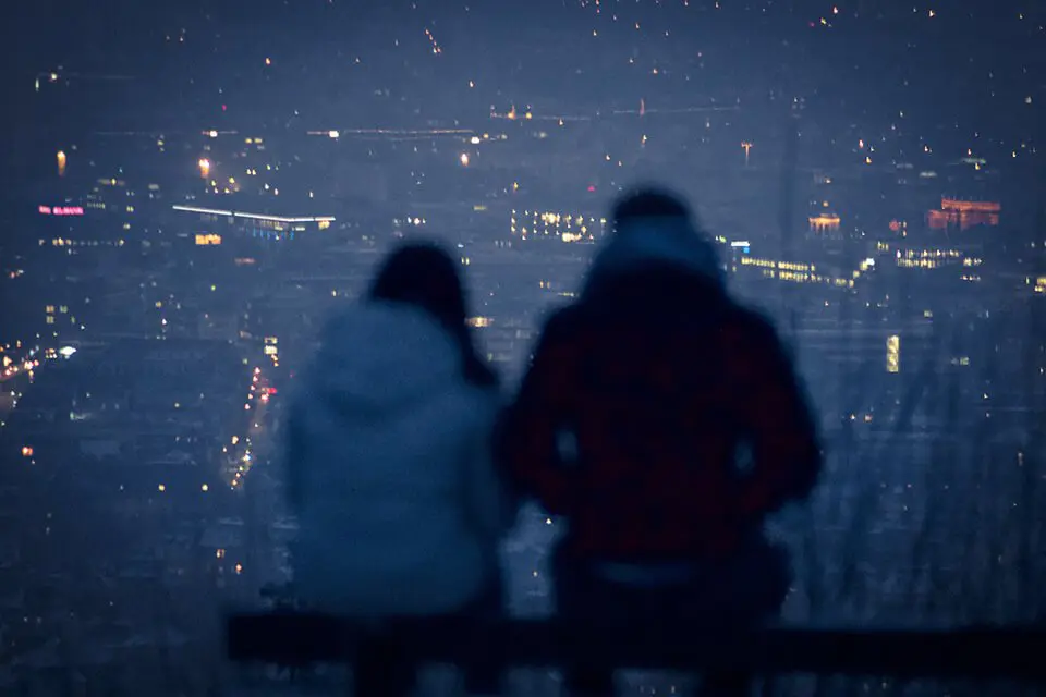 Couple sitting and overlooking a vista