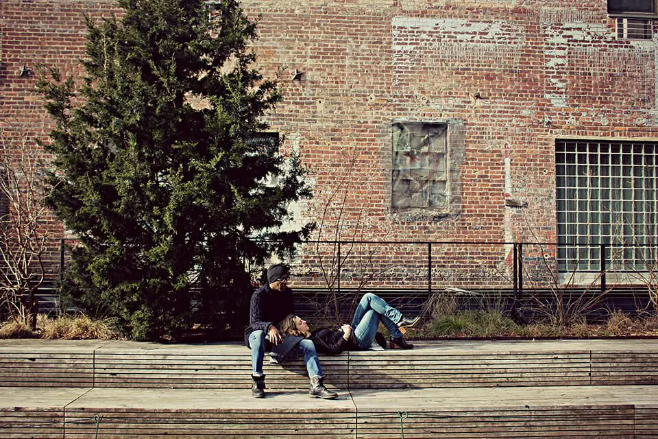 Couple hanging out outside of a building