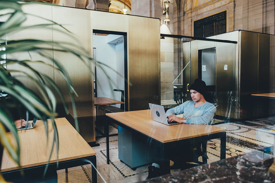 Man working on his laptop in an office