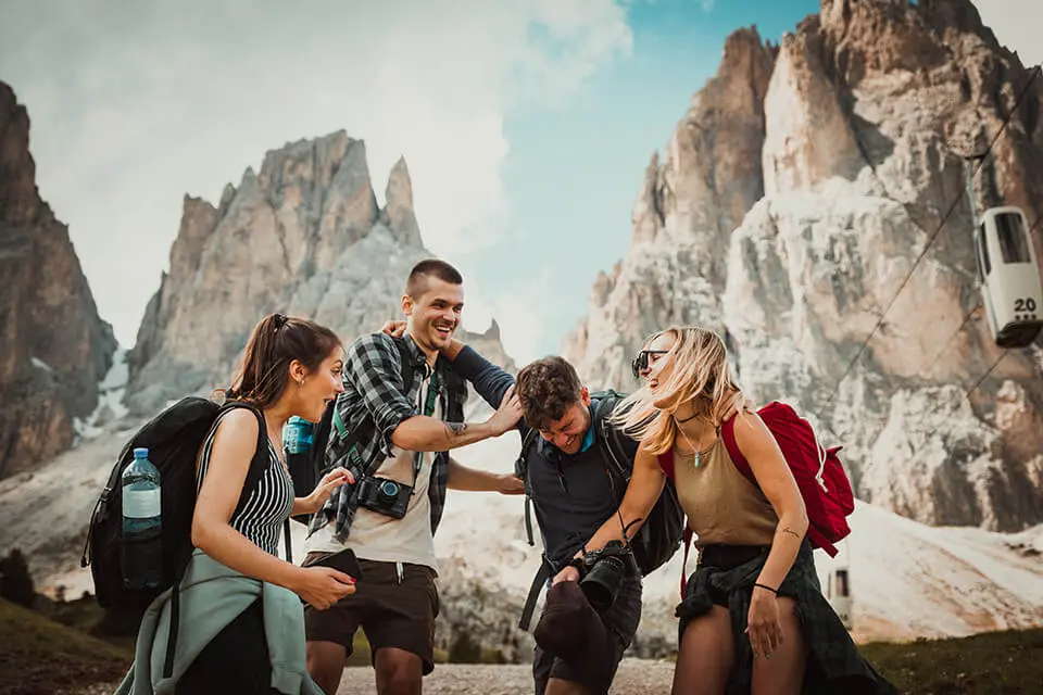 Group of friends circled around one another laughing