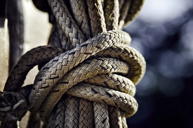 A length of rope wound tightly and bound around itself.