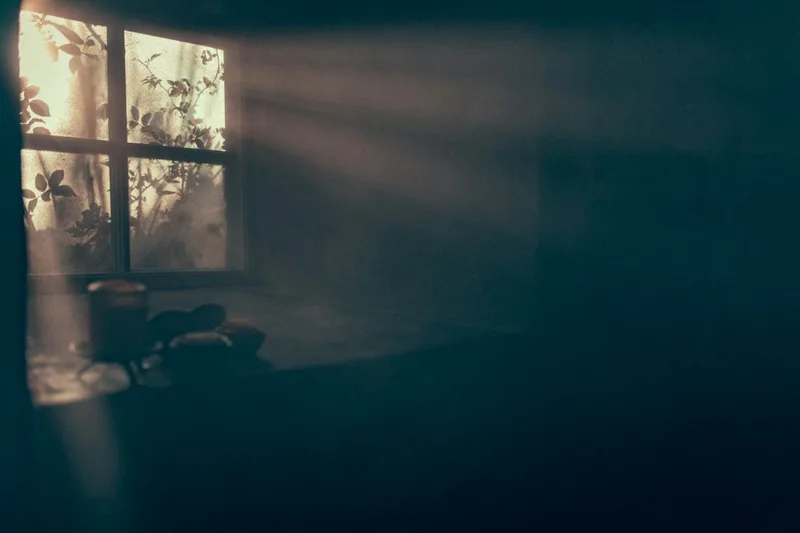 A soft beam of daylight coming through a window into a quiet room.