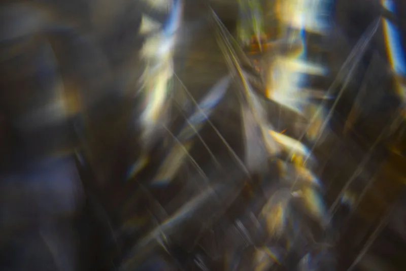 Abstract streaks of light and shadow overlapping, suggesting fragmented attention