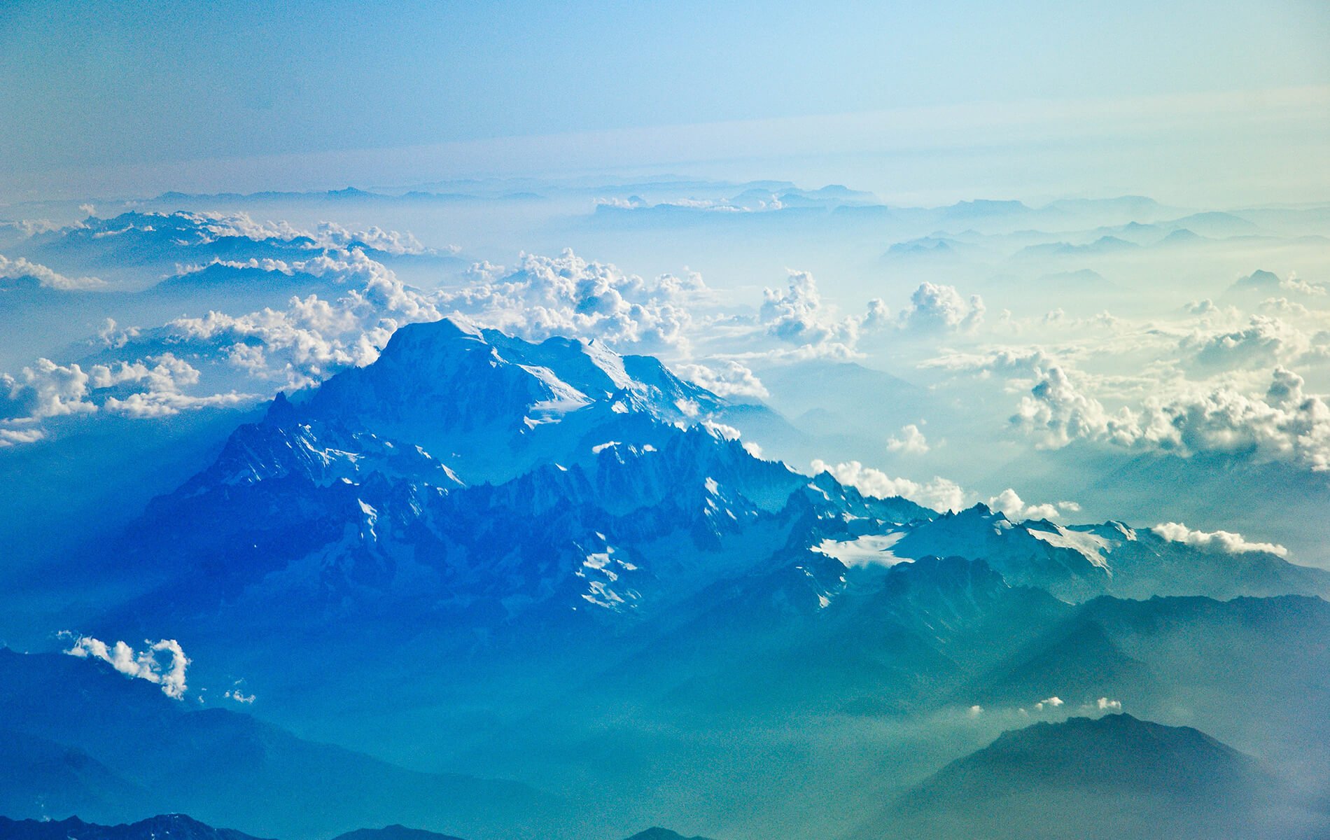 a view of a mountain range from an airplane.