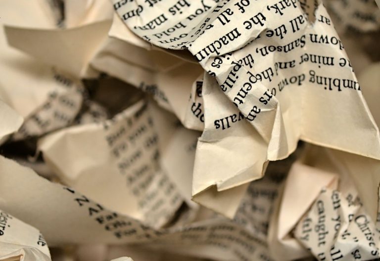 a close up of a pile of newspapers.