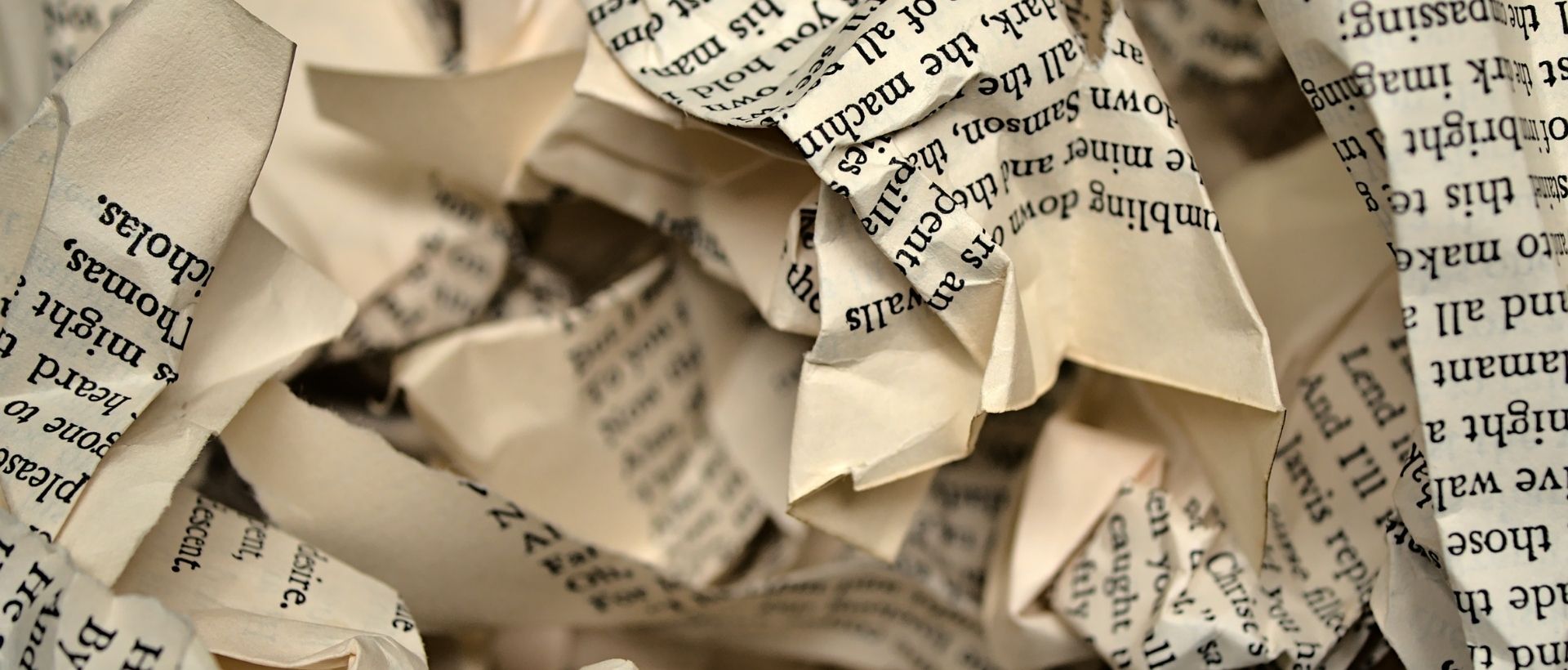 a close up of a pile of newspapers.