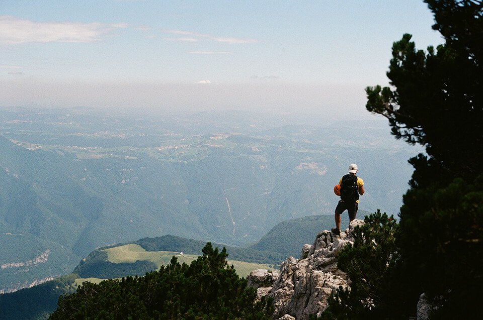Man standing on top of mountain