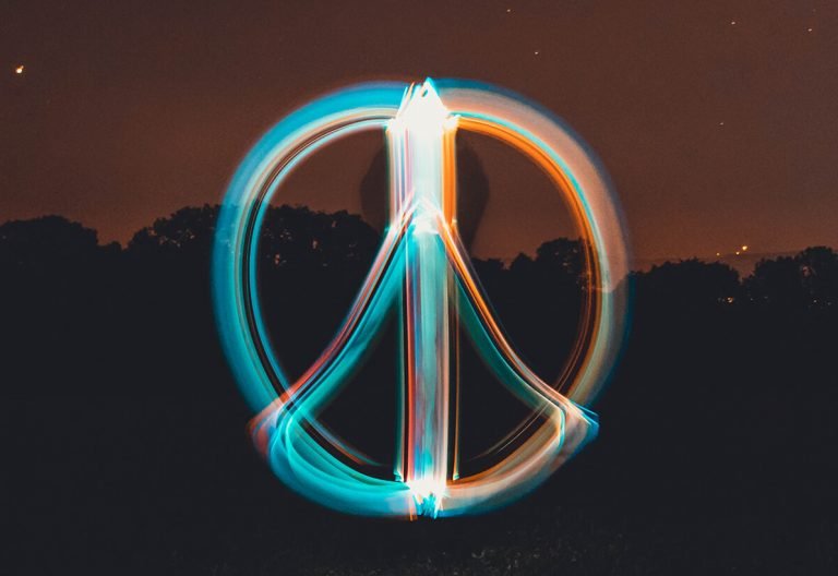 a long exposure photo of a peace sign.